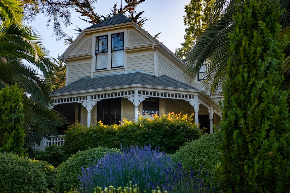 Ornamental trees and garden beds in front of a well-landscaped home