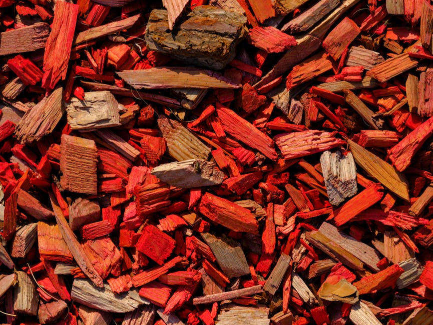 Close-up of red wood mulch pieces for garden bed protection